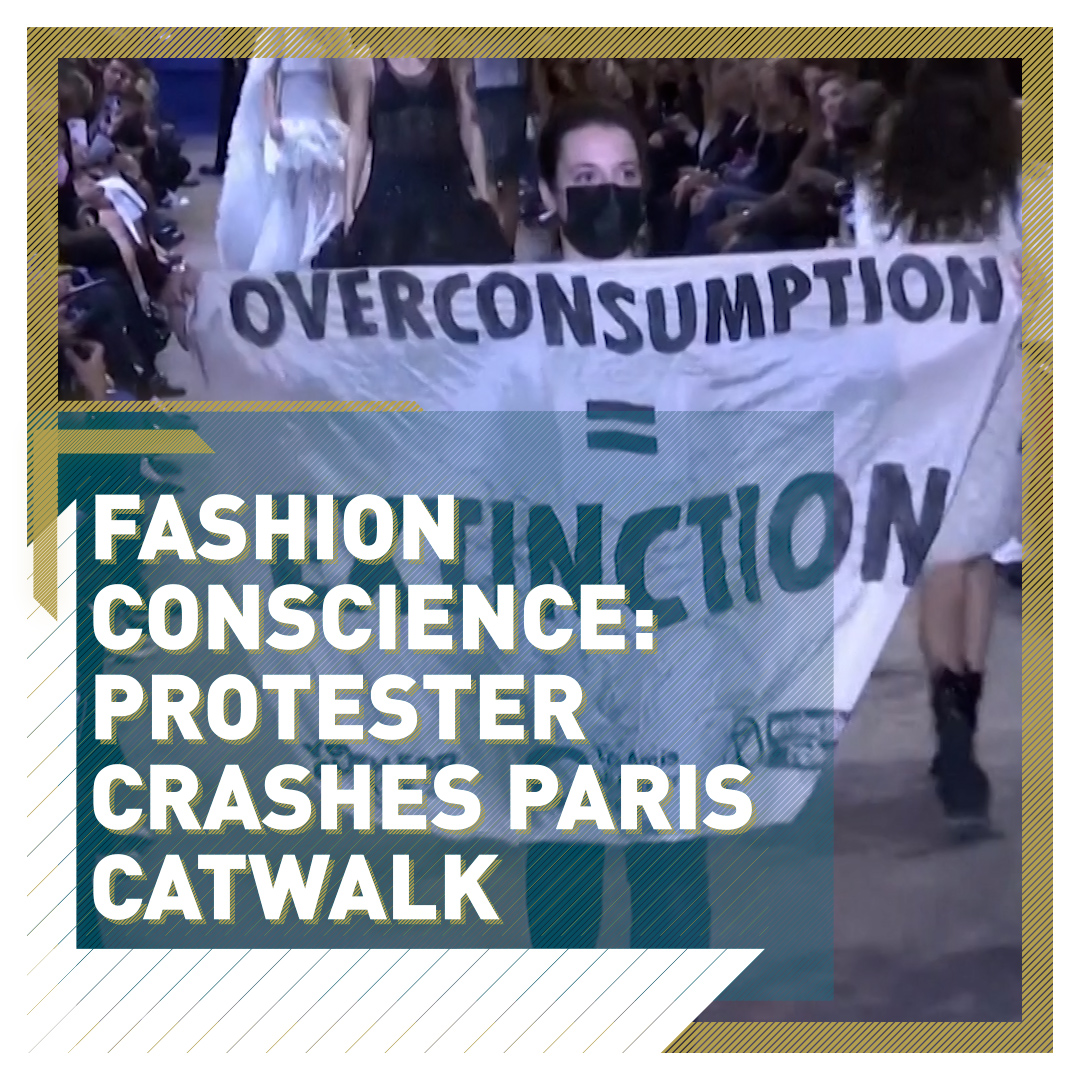 Protester with climate change banner crashes Louis Vuitton show, tackled by  security
